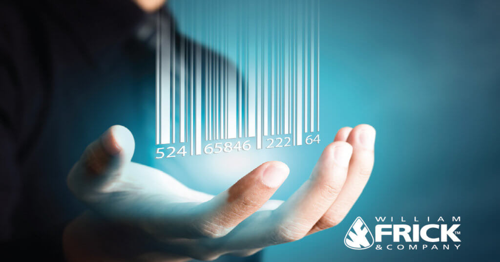 A person's hand underneath a stylized 3D bar code.