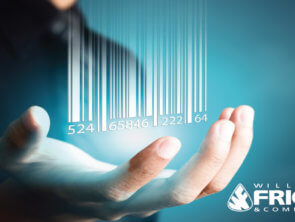 A person's hand underneath a stylized 3D bar code.